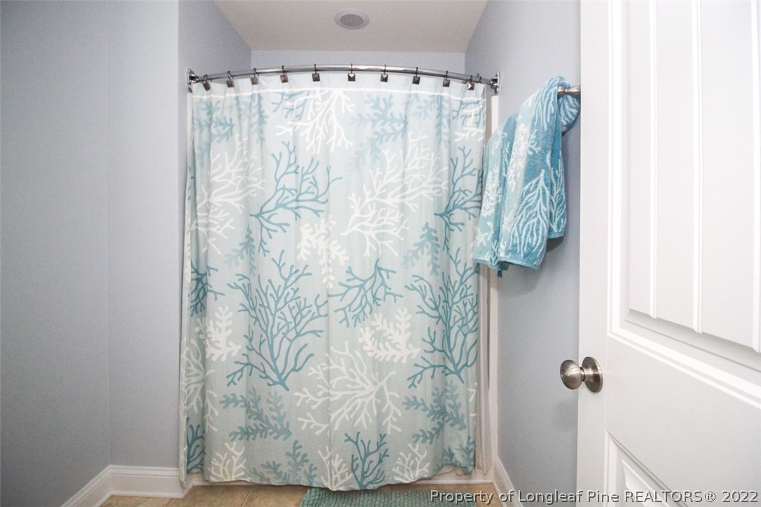 3549 Thrower Road Hope Mills, NC 28348 - Photo 31 of 38 a bathroom with a shower curtain and a sink