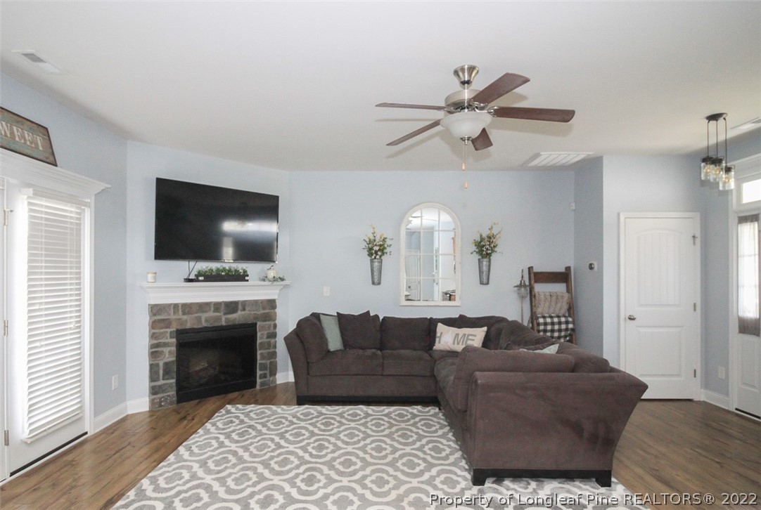 3549 Thrower Road Hope Mills, NC 28348 - Photo 5 of 38 a living room with furniture fireplace and flat screen tv