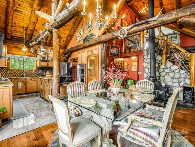 a view of a patio with table and chairs and potted plants