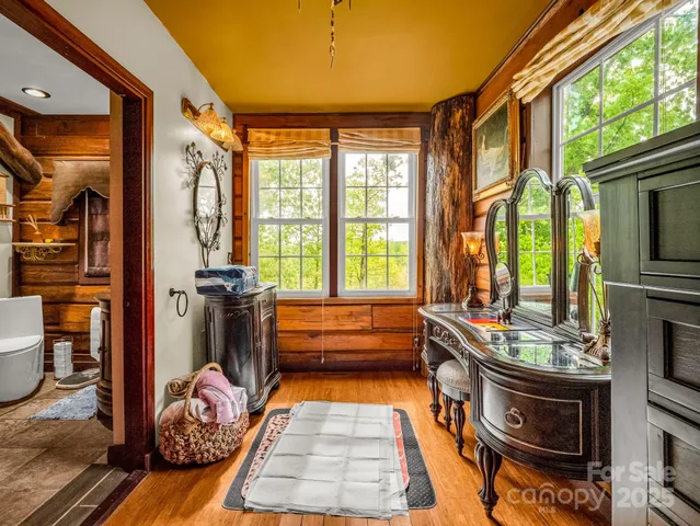 a living room with furniture fireplace and flat screen tv