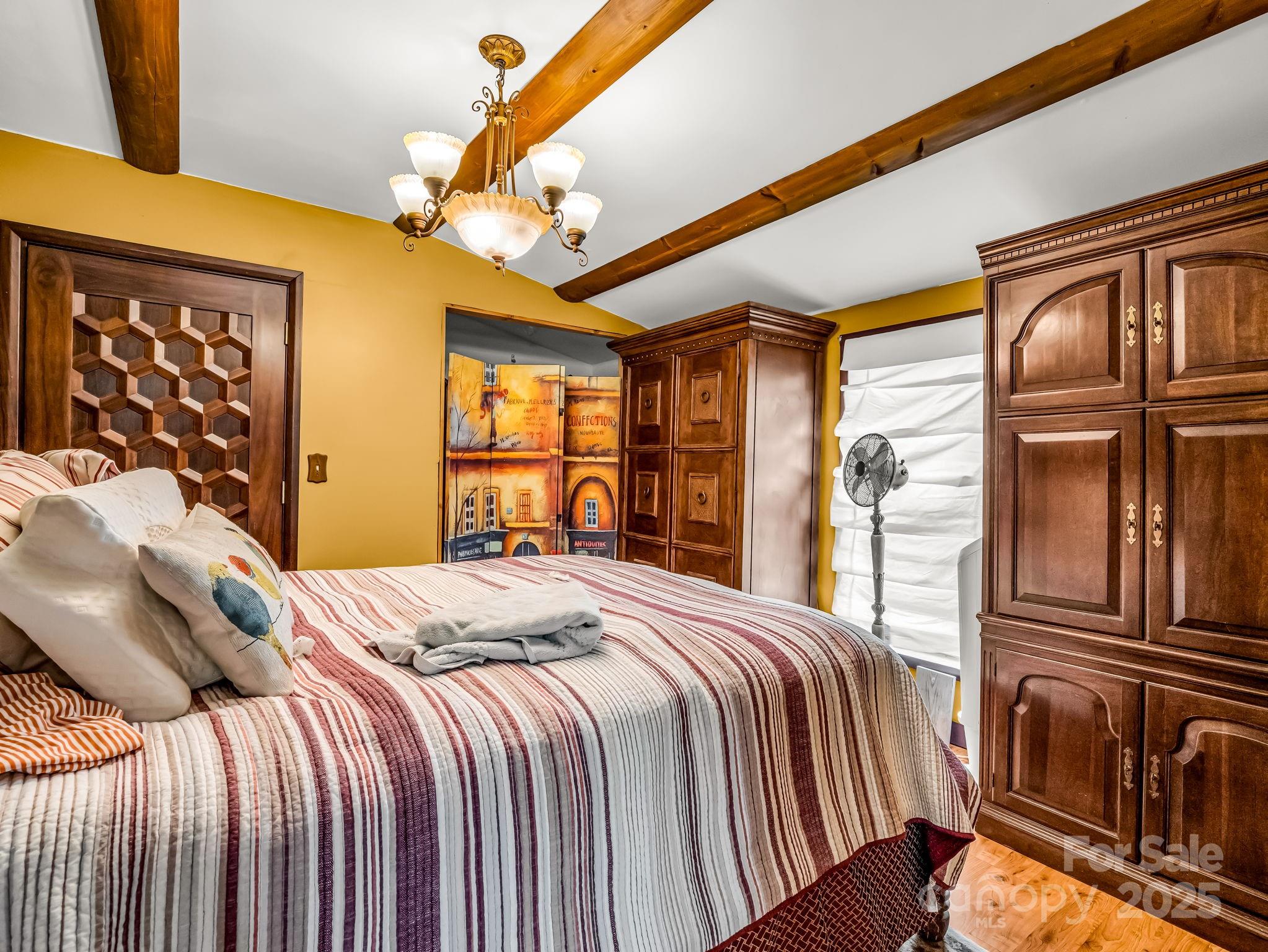 1002 C C Road Rutherfordton, NC 28139 - Photo 20 of 48 a bedroom with a bed next to a window