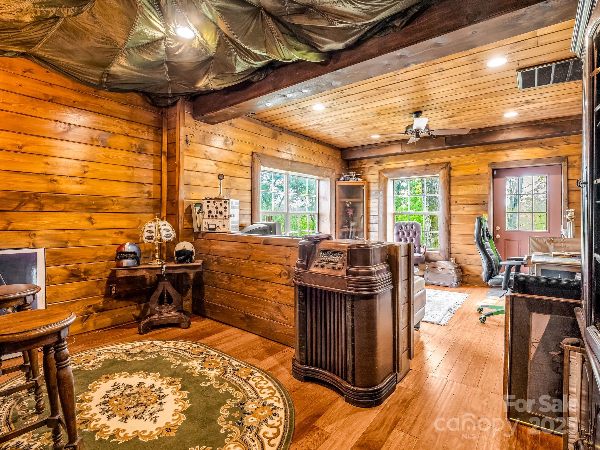 1002 C C Road Rutherfordton, NC 28139 - Photo 25 of 48 a view of a dining room with furniture a chandelier and large windows