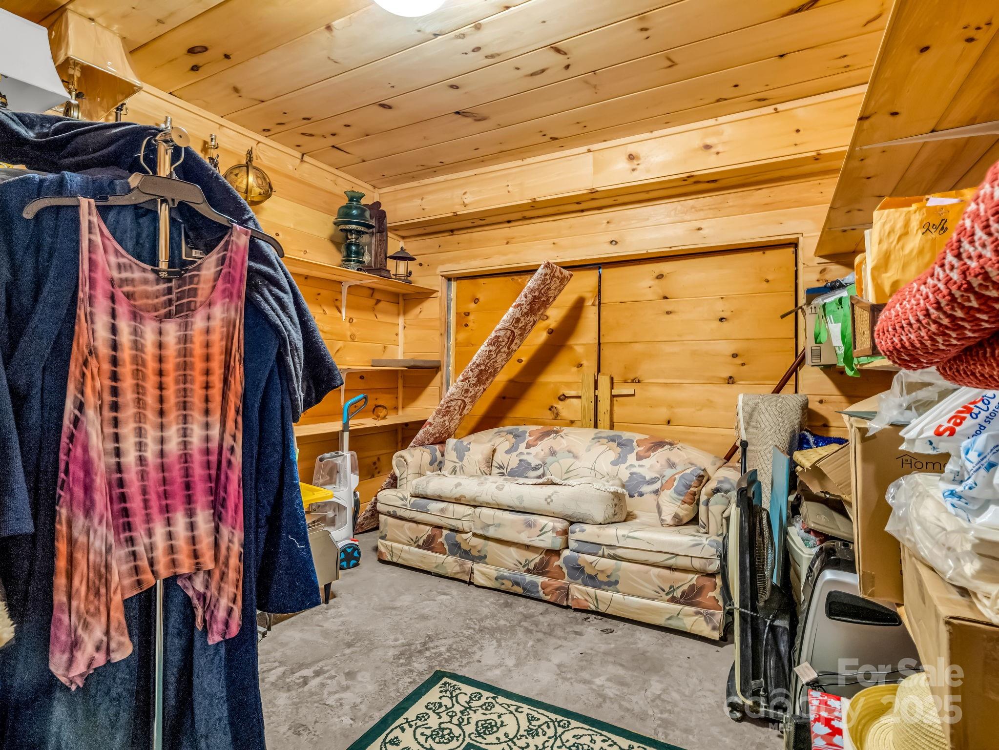 1002 C C Road Rutherfordton, NC 28139 - Photo 27 of 48 a view of walk in closet with clothes and shoes