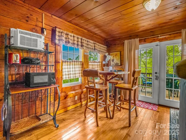 a living room with a table and chairs