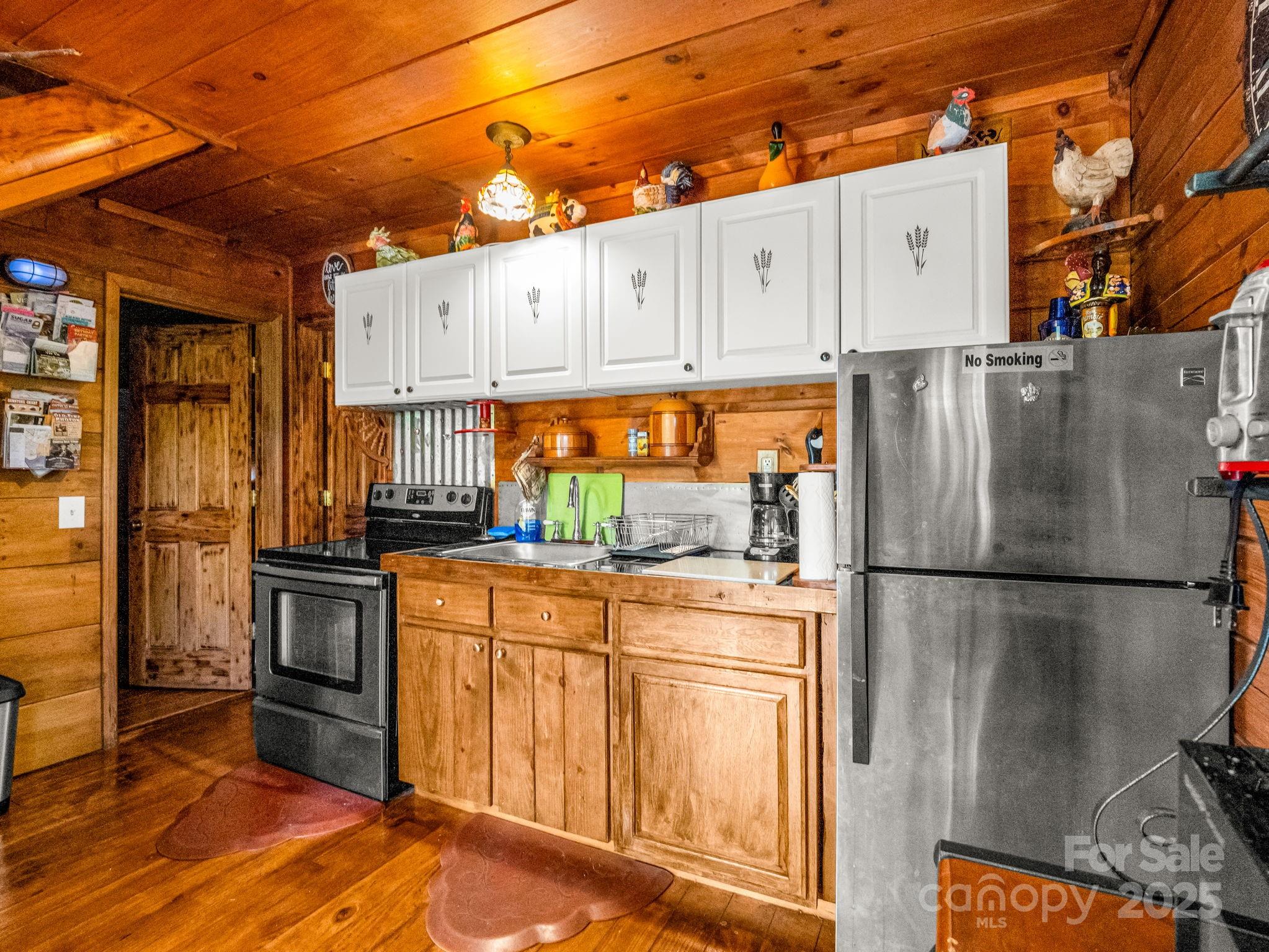1002 C C Road Rutherfordton, NC 28139 - Photo 33 of 48 a kitchen with cabinets and stainless steel appliances