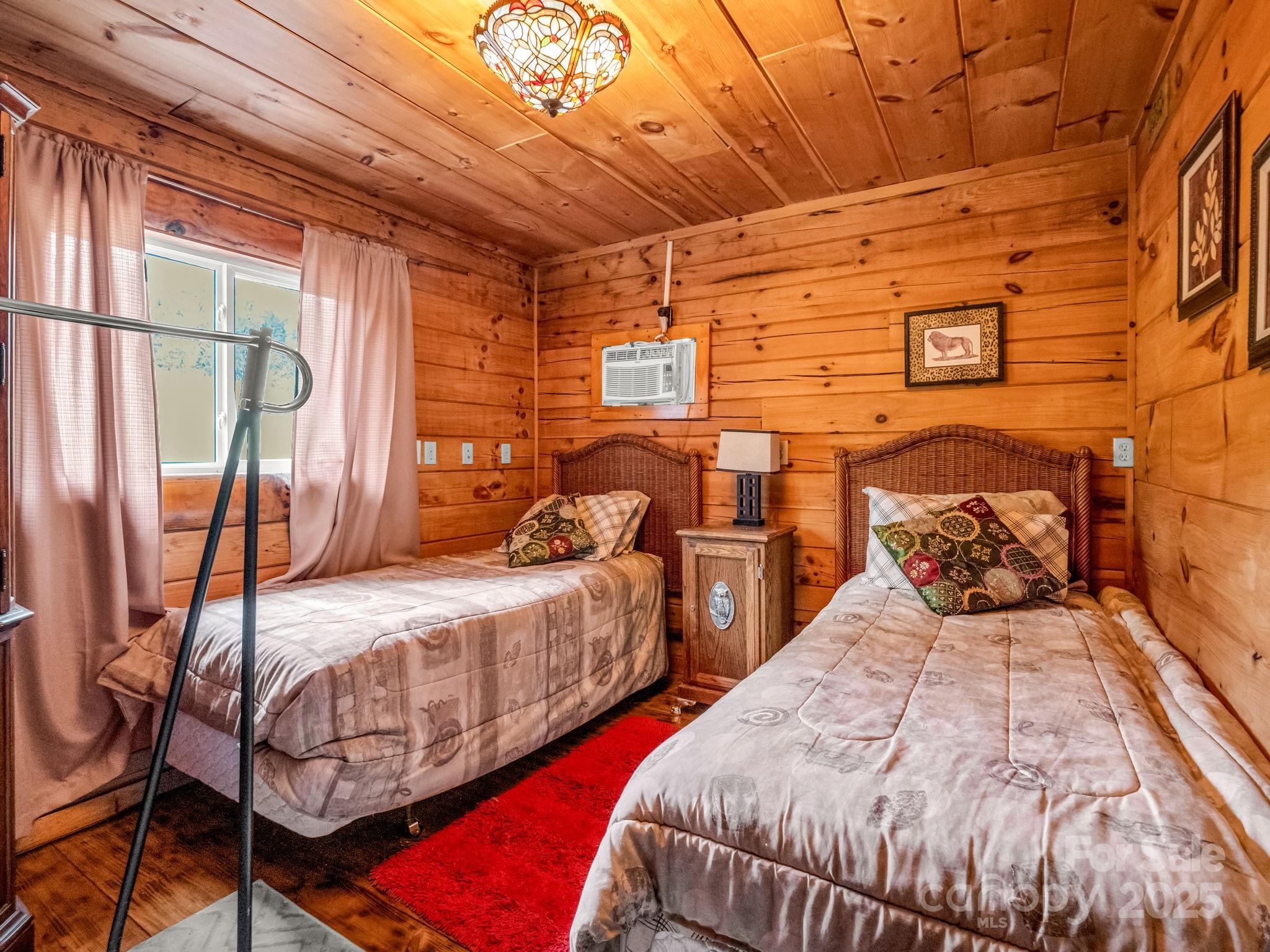 1002 C C Road Rutherfordton, NC 28139 - Photo 35 of 48 a bedroom with double bed and a window