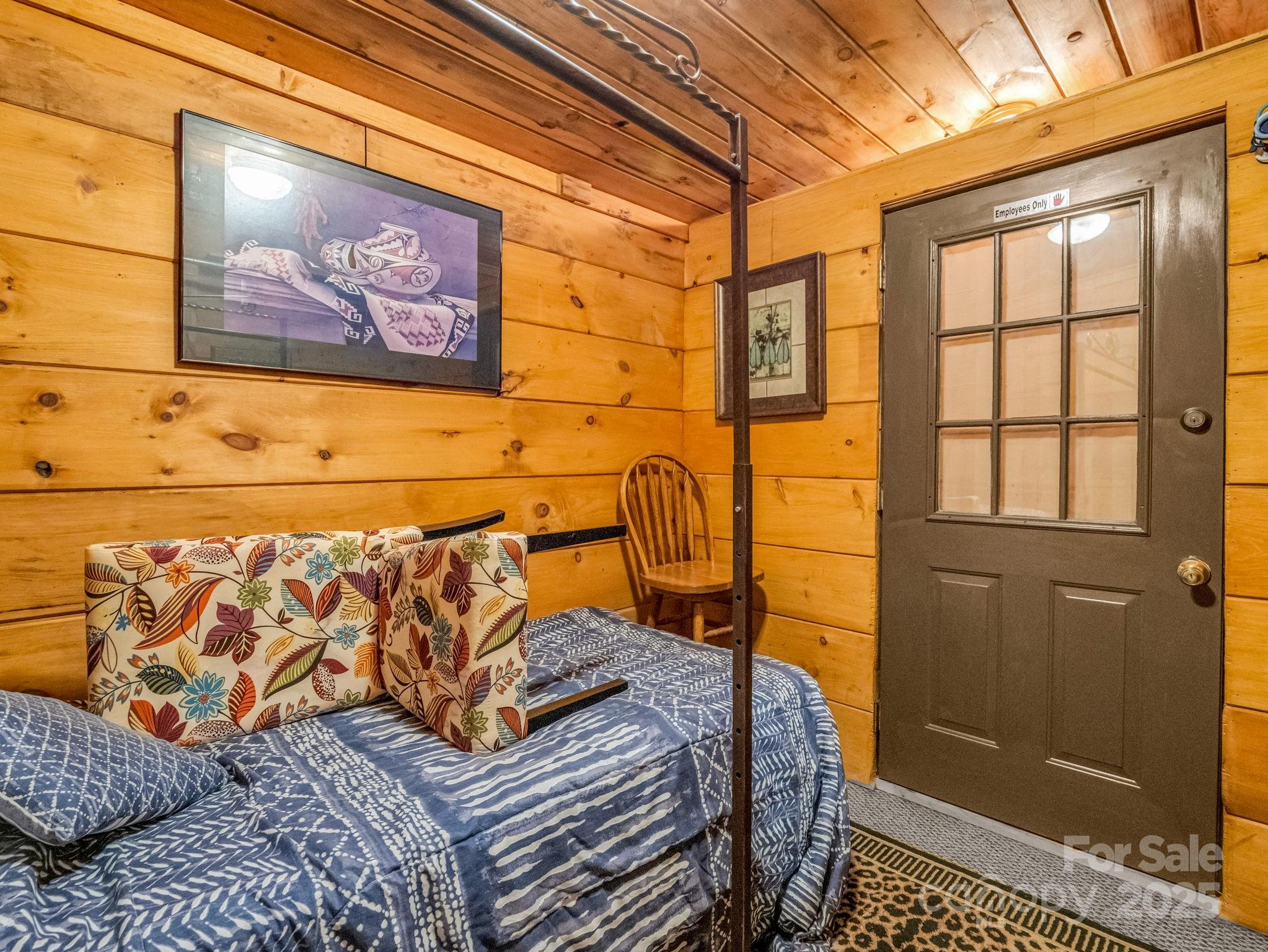 1002 C C Road Rutherfordton, NC 28139 - Photo 36 of 48 a bedroom with a bed and a painting on the wall