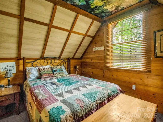 a view of a backyard with plants and trees