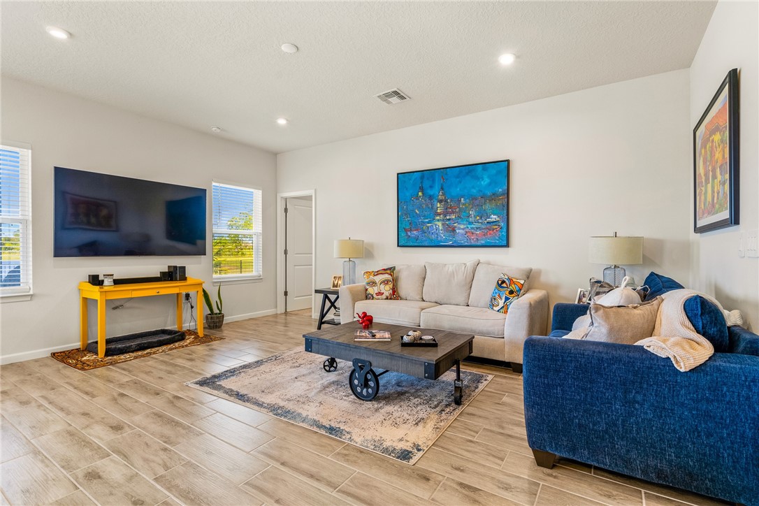 4202 Keeson Circle Vero Beach, FL 32967 - Photo 13 of 36 a living room with furniture and a flat screen tv