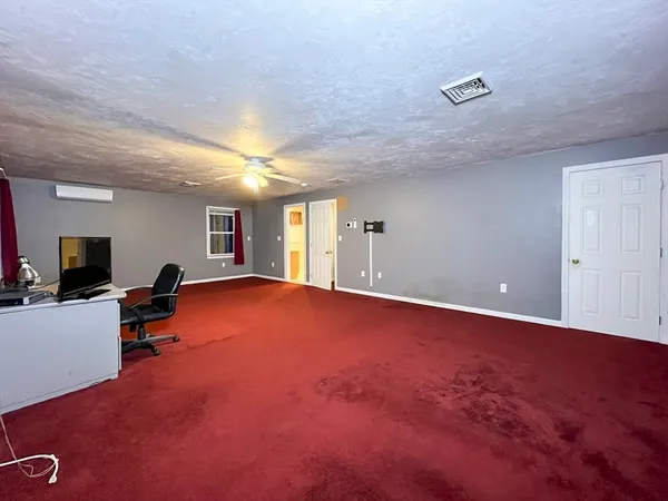 a view of livingroom with hardwood floor and a flat screen tv