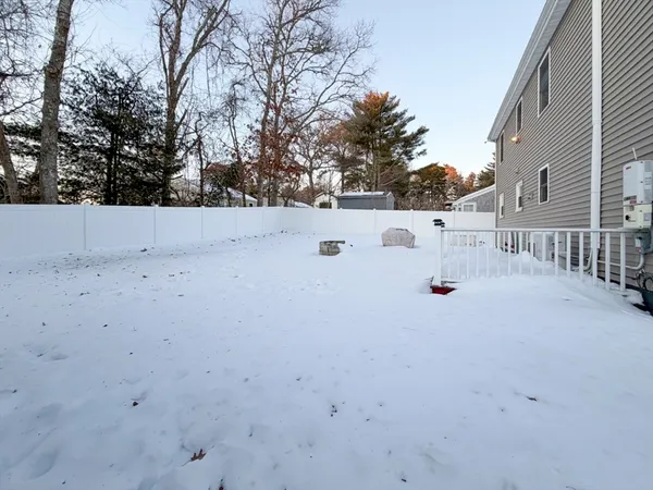 a view of white house with a yard