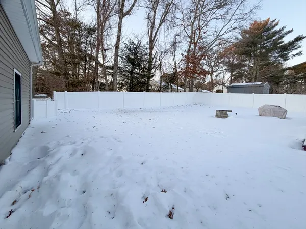 a view of covered with snow in back yard