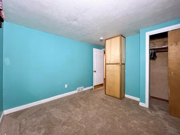 a view of a kitchen with a fridge