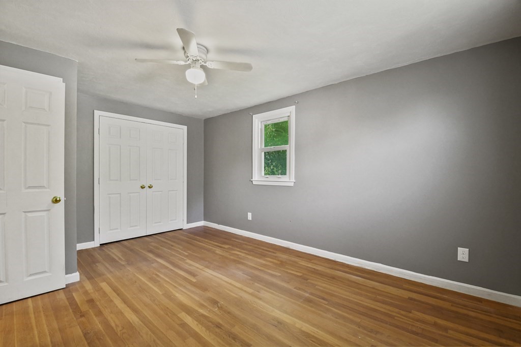 40 Orton Street Worcester, MA 01604 - Photo 13 of 28 a view of an empty room with wooden floor and a window