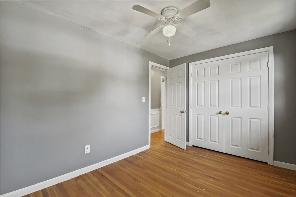 40 Orton Street Worcester, MA 01604 - Photo 16 of 28 an empty room with wooden floor and windows