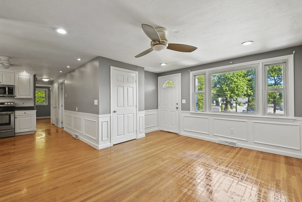 40 Orton Street Worcester, MA 01604 - Photo 2 of 28 a view of an empty room with wooden floor and a window