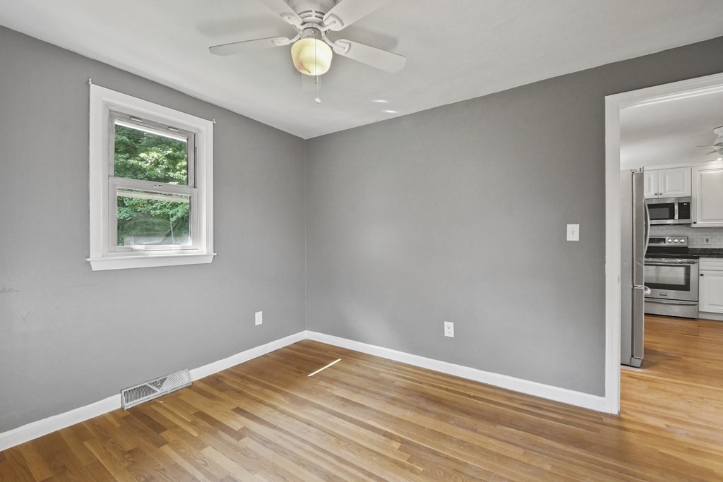 40 Orton Street Worcester, MA 01604 - Photo 21 of 28 wooden floor in an empty room with a window