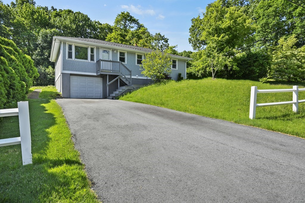 40 Orton Street Worcester, MA 01604 - Photo 24 of 28 a front view of a house with a yard and trees