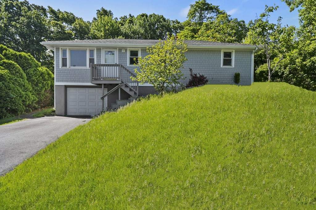 40 Orton Street Worcester, MA 01604 - Photo 25 of 28 a view of a house with a yard and plants
