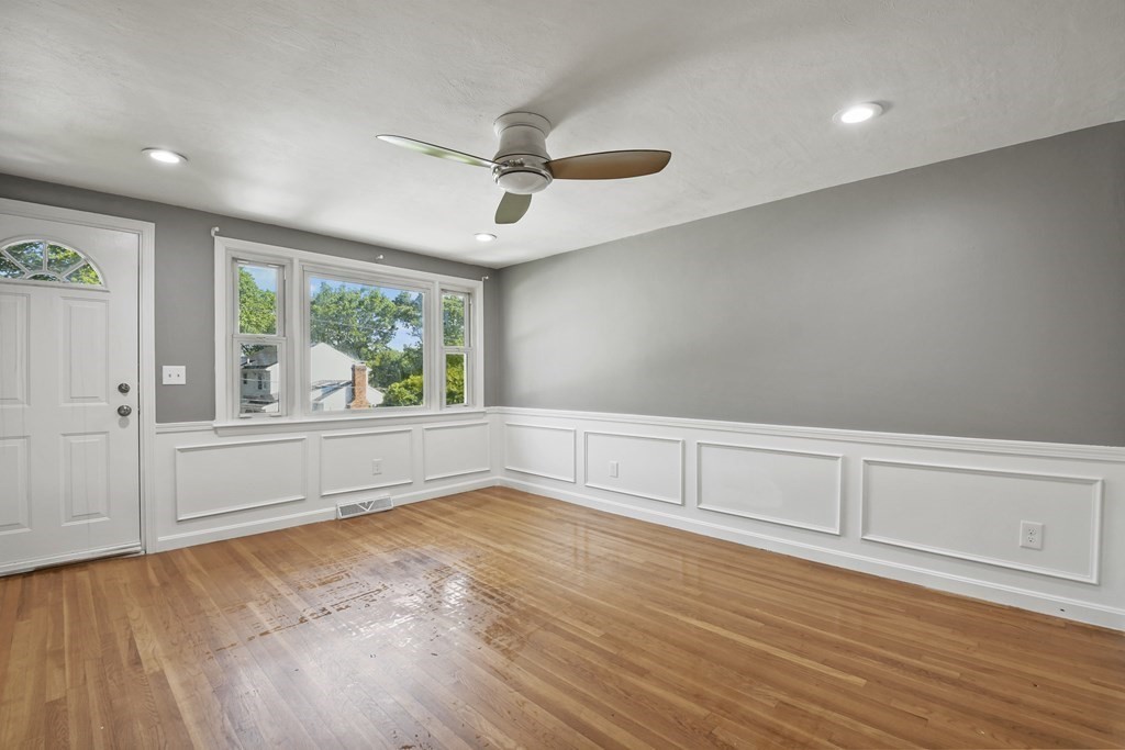 40 Orton Street Worcester, MA 01604 - Photo 3 of 28 an empty room with wooden floor and windows