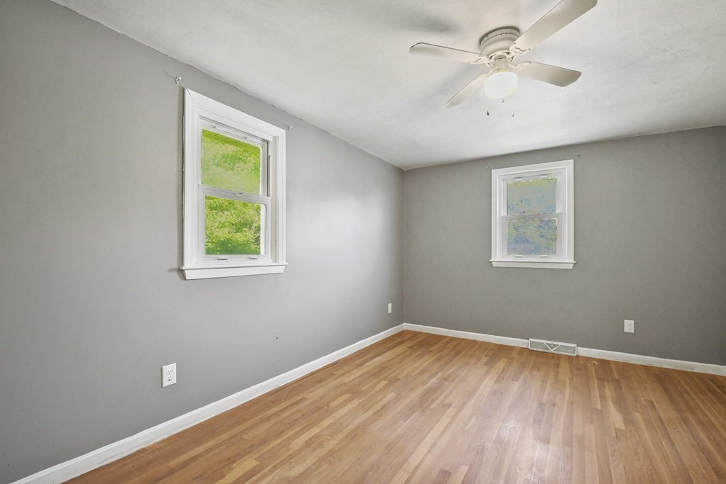 40 Orton Street Worcester, MA 01604 - Photo 10 of 28 a view of a room with a wooden floor and a window