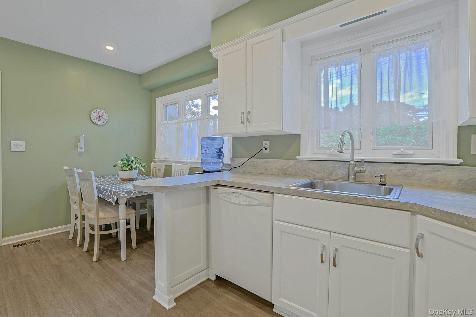 31 Townline Road Pearl River, NY 10965 - Photo 9 of 27 a kitchen with a sink table and chairs