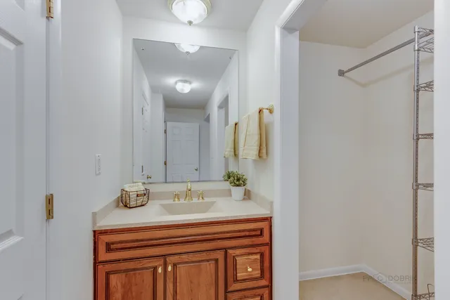 a bathroom with a glass shower door