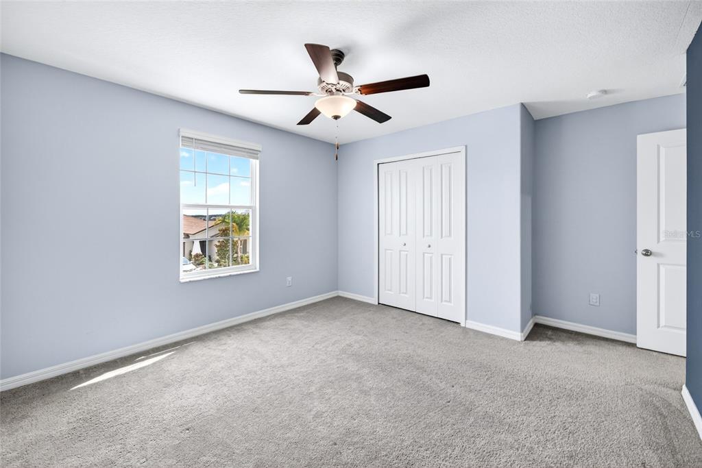 31724 Sun Kettle Loop Wesley Chapel, FL 33545 - Photo 21 of 49 a view of an empty room with a window