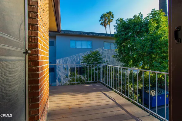 a view of balcony with furniture