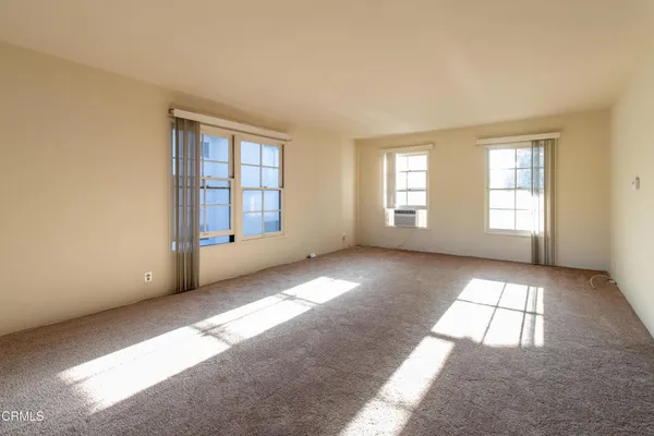a view of an empty room with a window