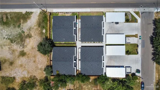 aerial view of a house with a yard