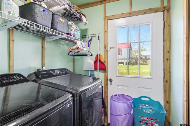 a utility room with dryer and washer