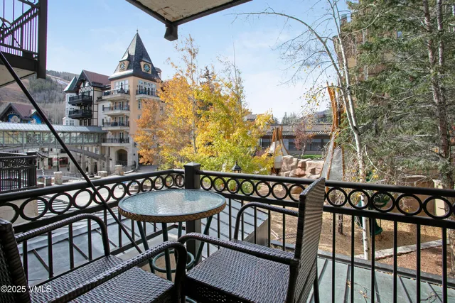 a view of a chairs and table in the patio