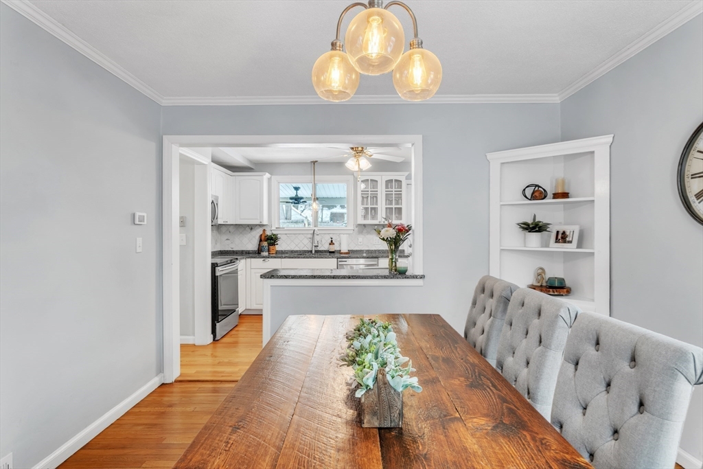 65 Bangor Street Springfield, MA 01118 - Photo 11 of 29 a large kitchen with lots of counter space wooden floor and stainless steel appliances