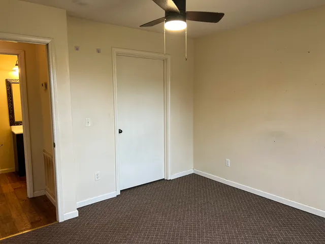 an empty room with a bathroom