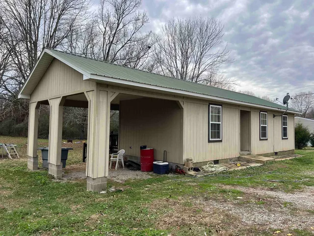 a backyard of a house with seating space