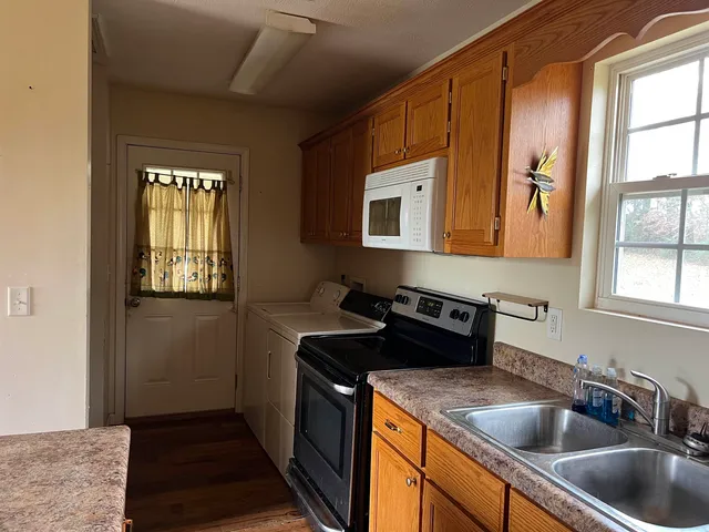 a kitchen that has a sink and a stove