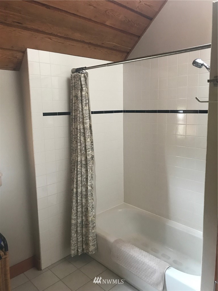 18527 Beall Road Southwest Vashon, WA 98070 - Photo 11 of 26 a bathroom with a bathtub and shower