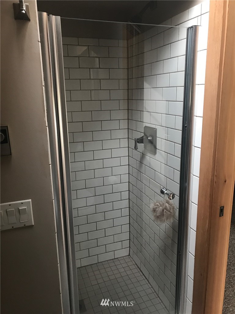 18527 Beall Road Southwest Vashon, WA 98070 - Photo 18 of 26 a bathroom with a shower