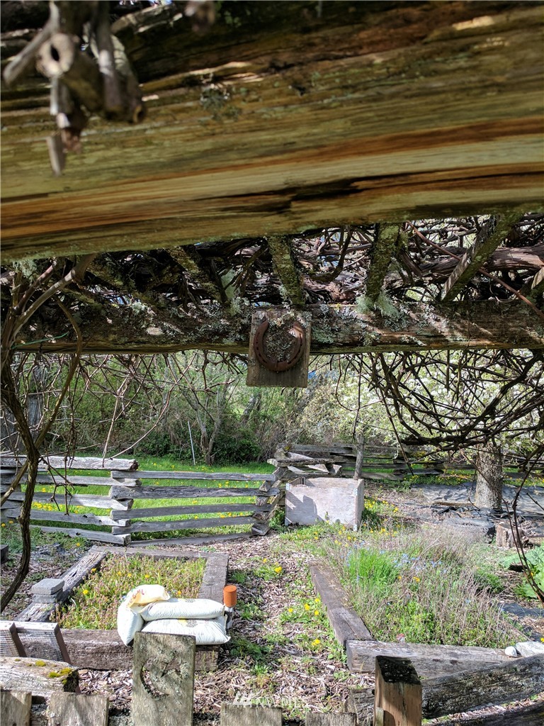 18527 Beall Road Southwest Vashon, WA 98070 - Photo 20 of 26 a view of a backyard with wooden fence
