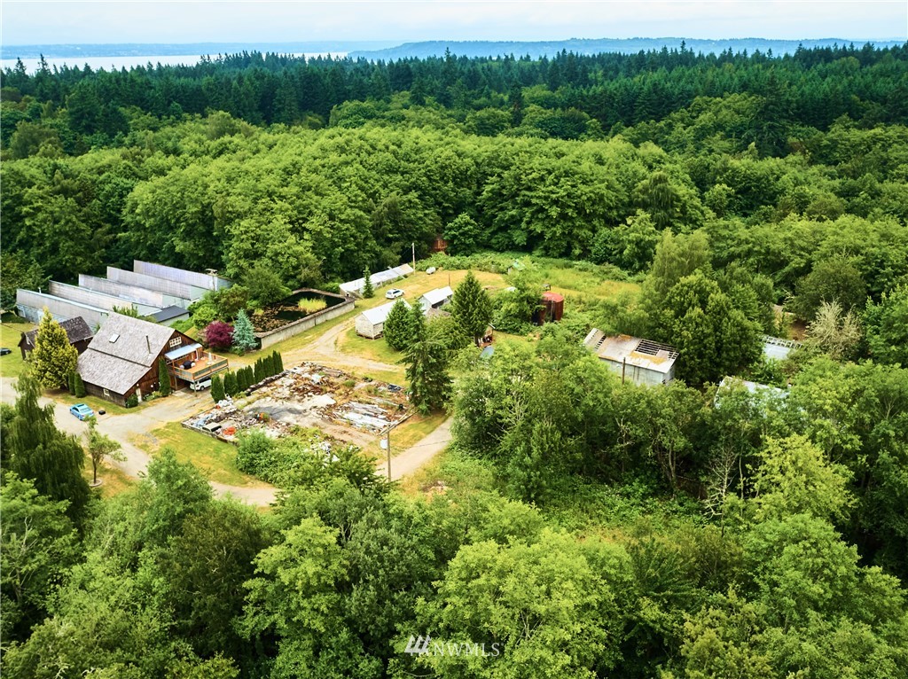18527 Beall Road Southwest Vashon, WA 98070 - Photo 2 of 26 a aerial view of residential house with outdoor space and trees all around
