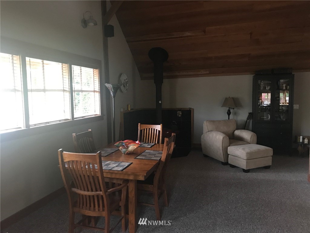 18527 Beall Road Southwest Vashon, WA 98070 - Photo 8 of 26 a living room with furniture and a window