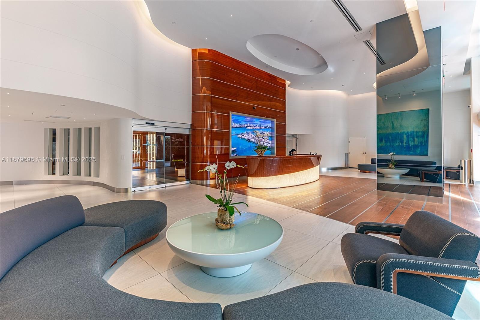 90 Alton Road, Unit 1703 Miami Beach, FL 33139 - Photo 21 of 48 a living room with furniture and a large window