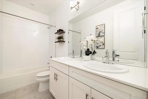 a spacious bedroom with a bed and a window