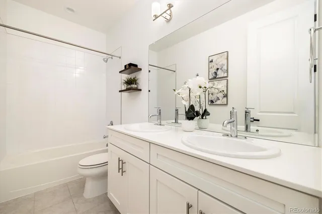 a spacious bedroom with a bed and a window