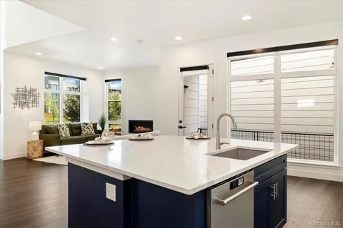 a kitchen with stainless steel appliances a sink stove and cabinets