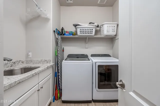 a utility room with dryer and washer