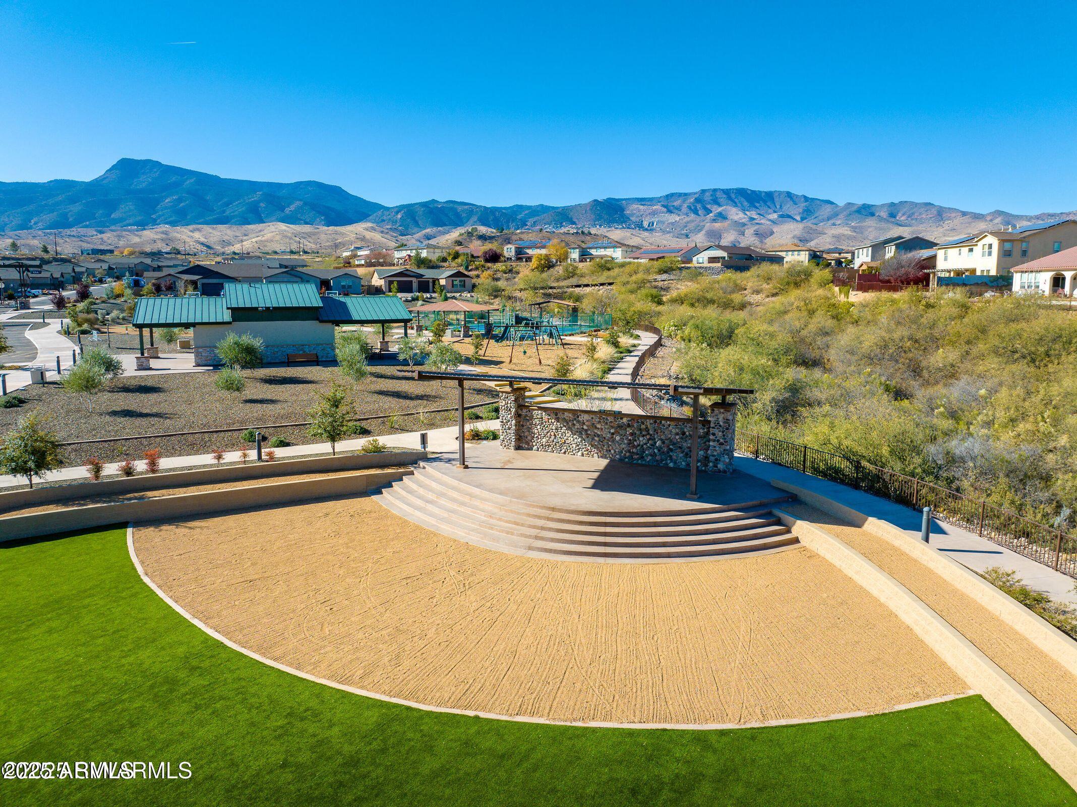 439 McKinnon Road Clarkdale, AZ 86324 - Photo 29 of 39 a view of a swimming pool with a table chairs and a fire pit