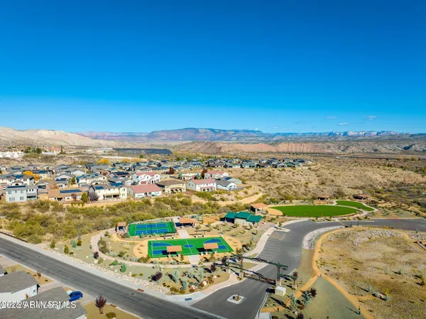 an aerial view of residential building and ocean view
