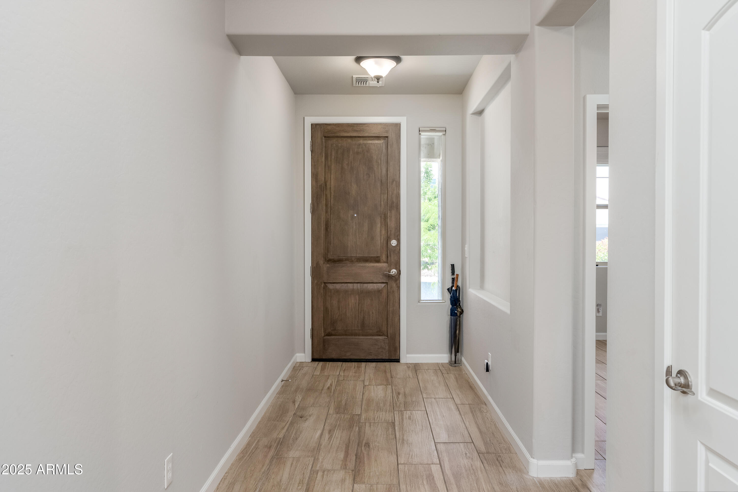 439 McKinnon Road Clarkdale, AZ 86324 - Photo 3 of 39 a view of a hallway with wooden floor and closet area